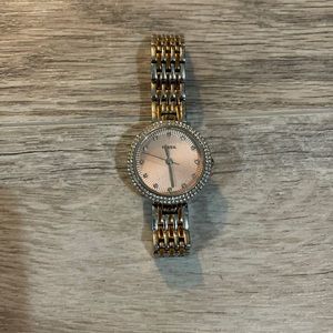 Rose gold and silver Fossil watch.